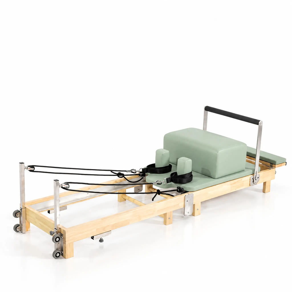 Foldable Maple Pilates Reformer with Sage Green Upholstery and Upright Storage